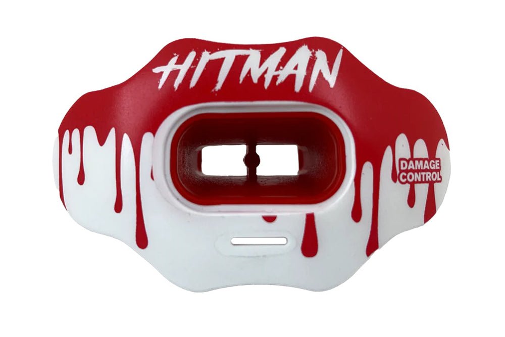 Red and white mouthguard with 'Hitman' text